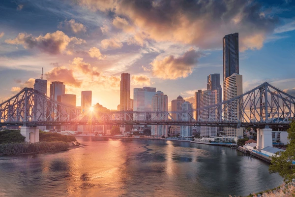 Brisbane city skyline and Story Bridge at sunset.